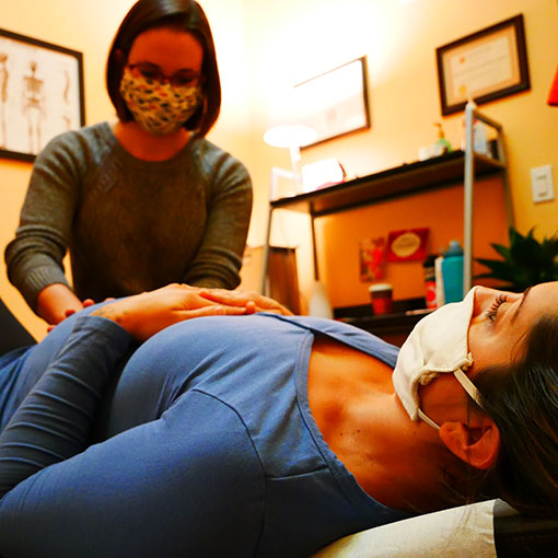 Dr. Carolyn Wojtusiak working with a pregnant client